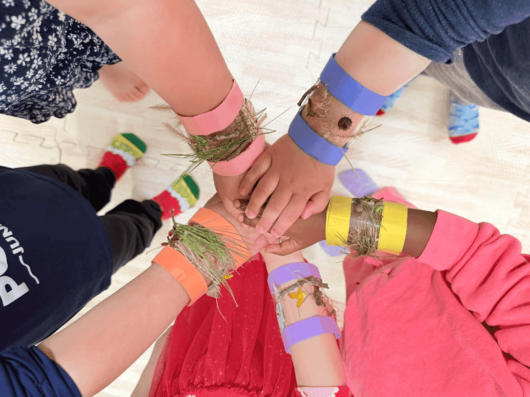 children hands with nature bracelets