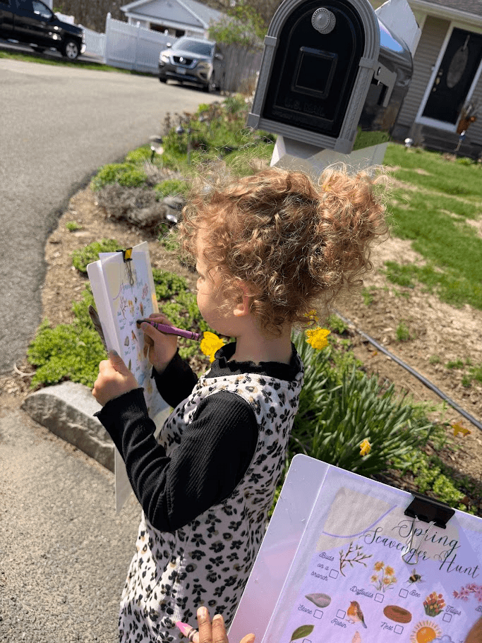 girl holding a clipboard and crayon