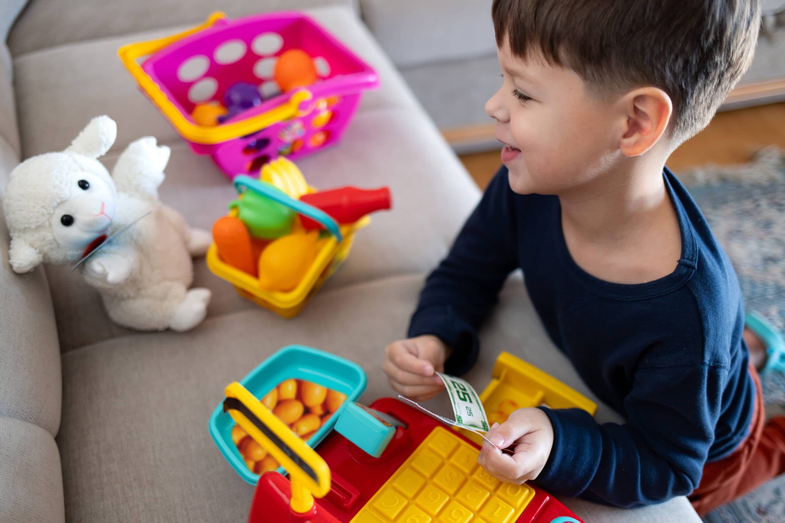 child playing with pretend money
