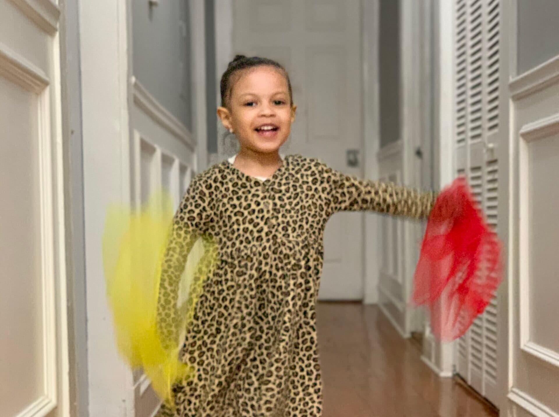 girl playing with scarves
